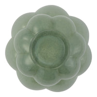Green floral-shaped bowl with a smooth, glossy finish and subtle variations in color. Perfect for decorative use.