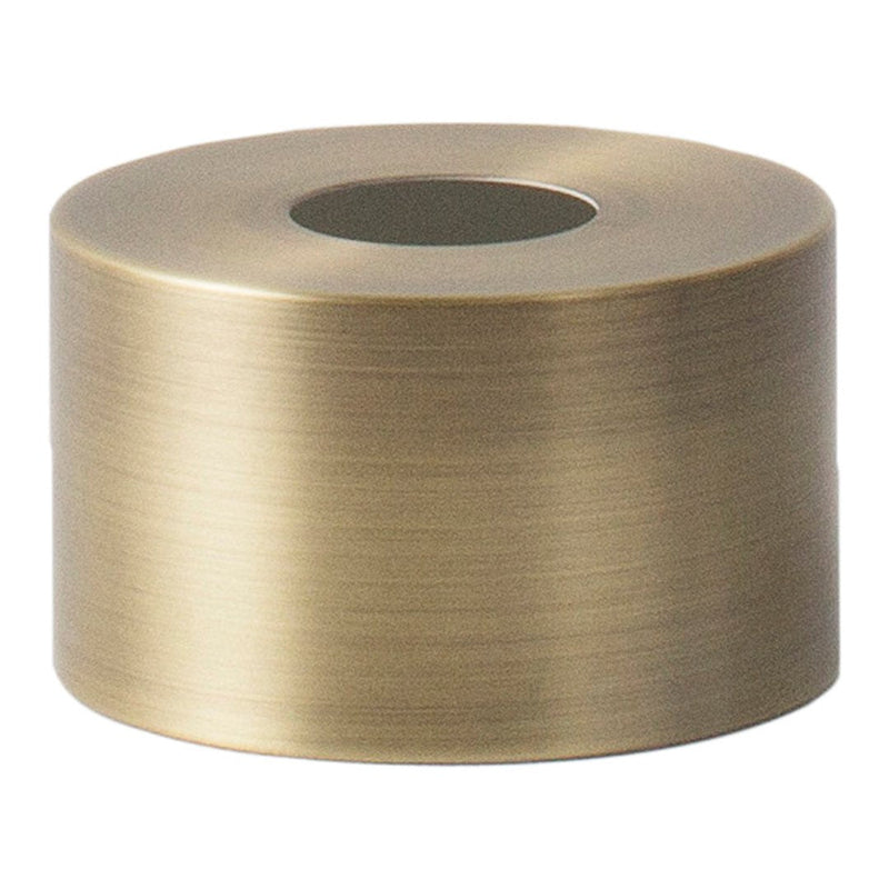 Brushed brass cylindrical tape roll with a smooth, reflective metallic surface and a central hole for easy usage.
