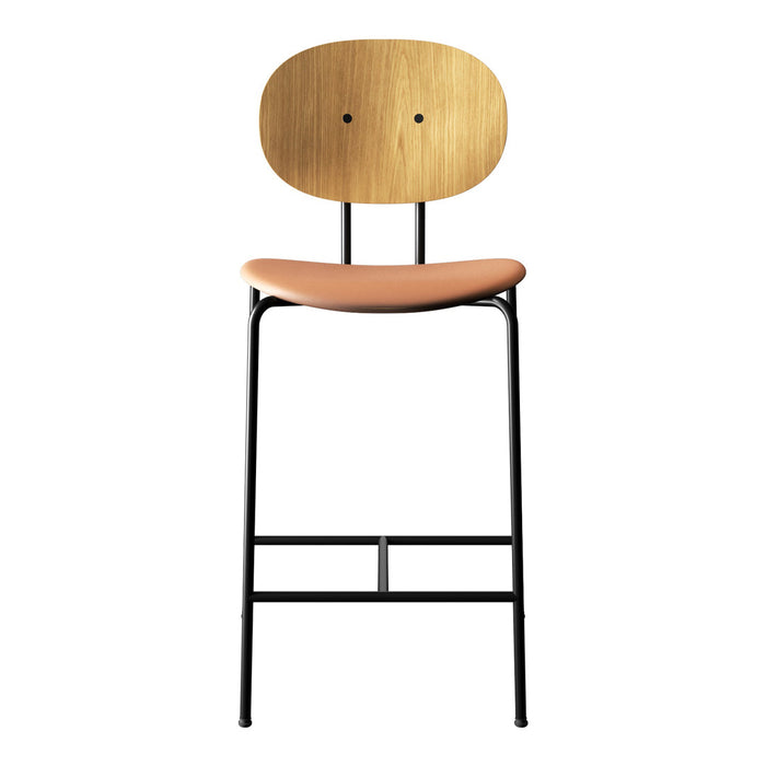 Natural wood seat and backrest with a peach cushion on a sleek black metal frame. Modern minimalist design.