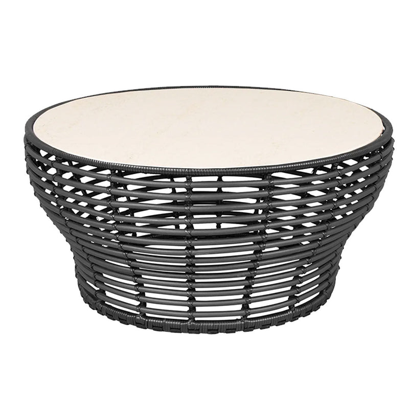 Black woven coffee table with a smooth cream-colored top and round shape, adding a modern touch to any decor.
