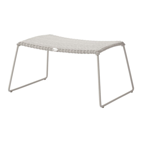 Light gray woven outdoor stool with a smooth, curved design and sturdy metal legs, perfect for cozy spaces.