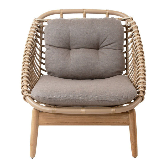 Natural rattan chair with light grey cushions and a woven pattern. Modern design for stylish seating.