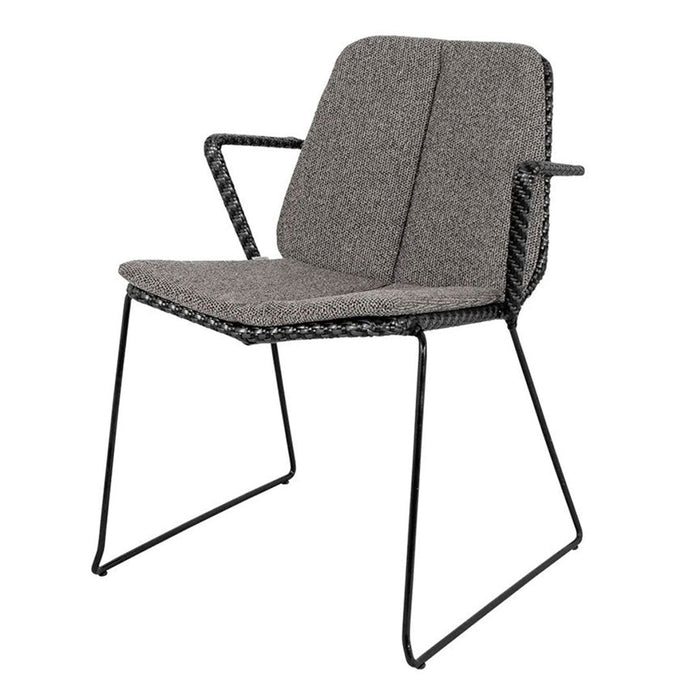 Gray upholstered chair with a textured fabric seat and black metal frame, featuring a modern, minimalist design.