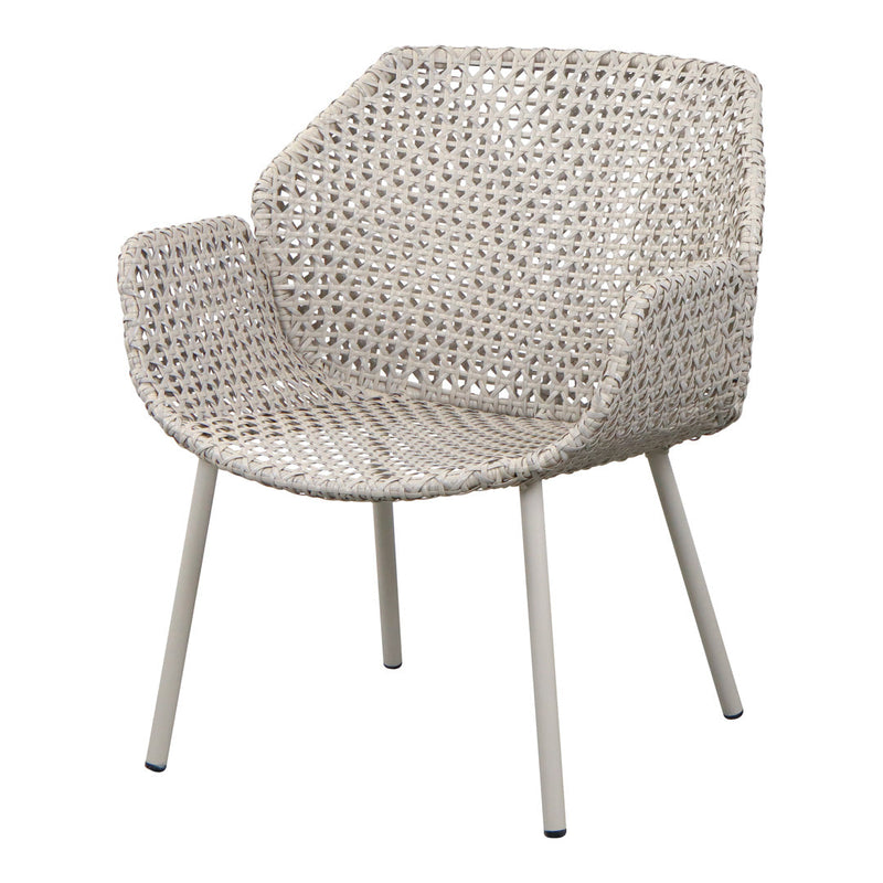 Light beige woven chair with a textured pattern and metal legs, perfect for a modern decor style.