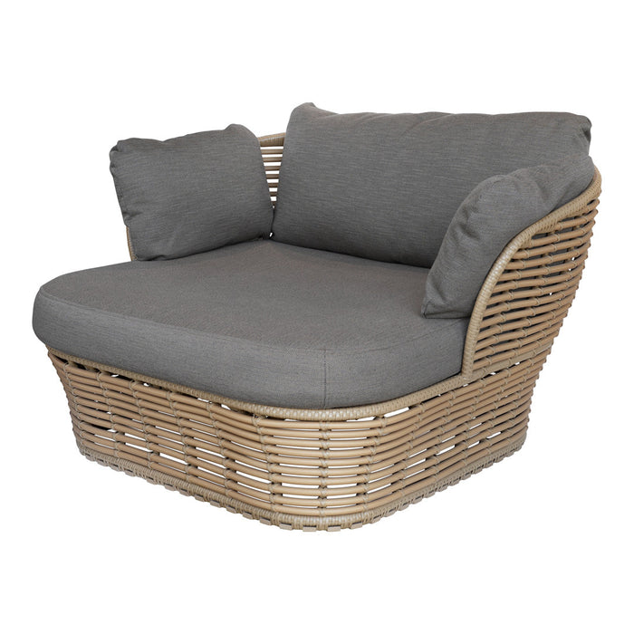 Gray cushion accent chair with a woven rattan base, featuring horizontal and vertical pattern details.