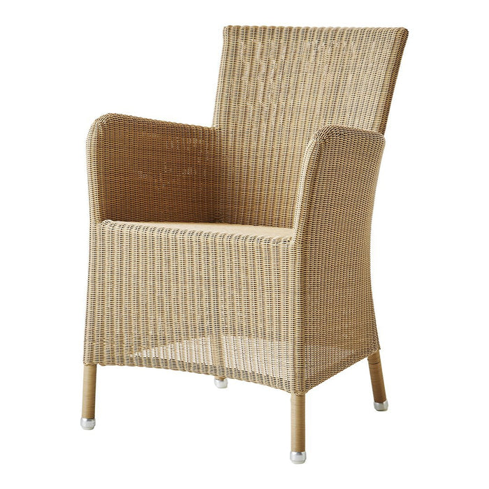 Natural beige wicker armchair with textured pattern and light wooden legs. Ideal for indoor or outdoor use.