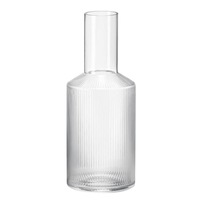 Clear glass vase with vertical ribbed pattern, showcasing a modern and sleek design. Ideal for elegant decor.