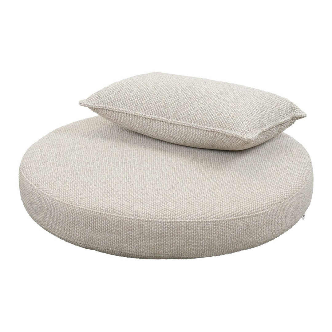Round cream cushion with a soft, textured surface and a matching rectangular pillow on top. Perfect for stylish comfort.