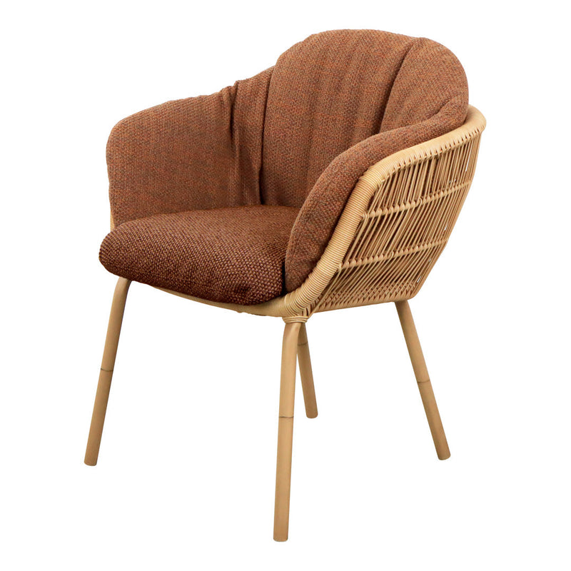 Brown upholstered chair with a woven rattan frame and light wood legs, featuring a cozy, textured fabric pattern.