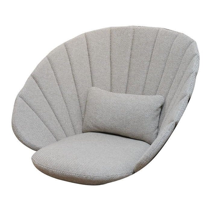 Soft gray oversized chair with unique shell-like design and vertical fabric panels. Includes a matching plush cushion.