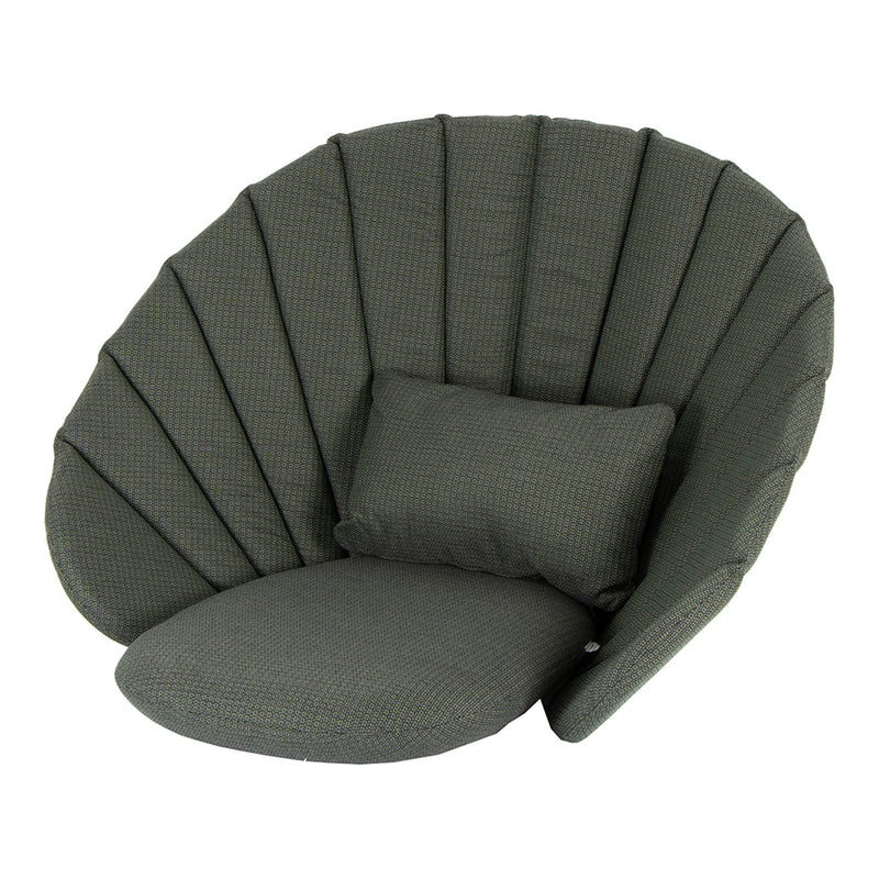 Green shell-shaped chair with padded, vertical stripes and a matching cushion. Modern, cozy design for any space.