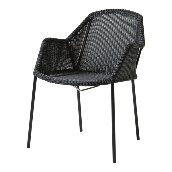 Black woven chair with a textured pattern and sleek black metal legs for modern decor.