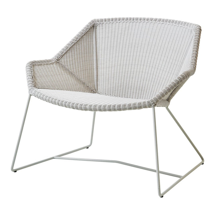 Stylish white patterned chair with a modern design, featuring a woven texture and minimalist metal legs.