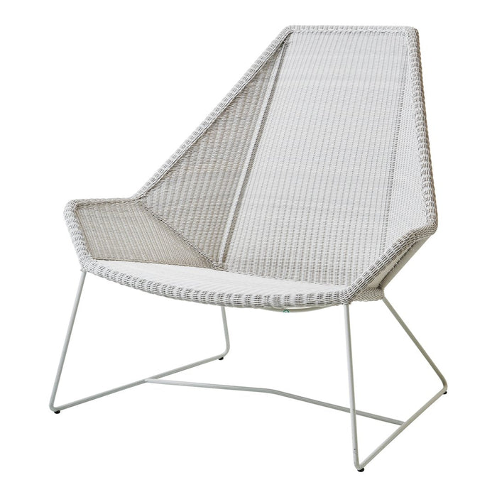 White striped lounge chair with a minimalist design and sleek metal legs. Perfect for modern outdoor spaces.