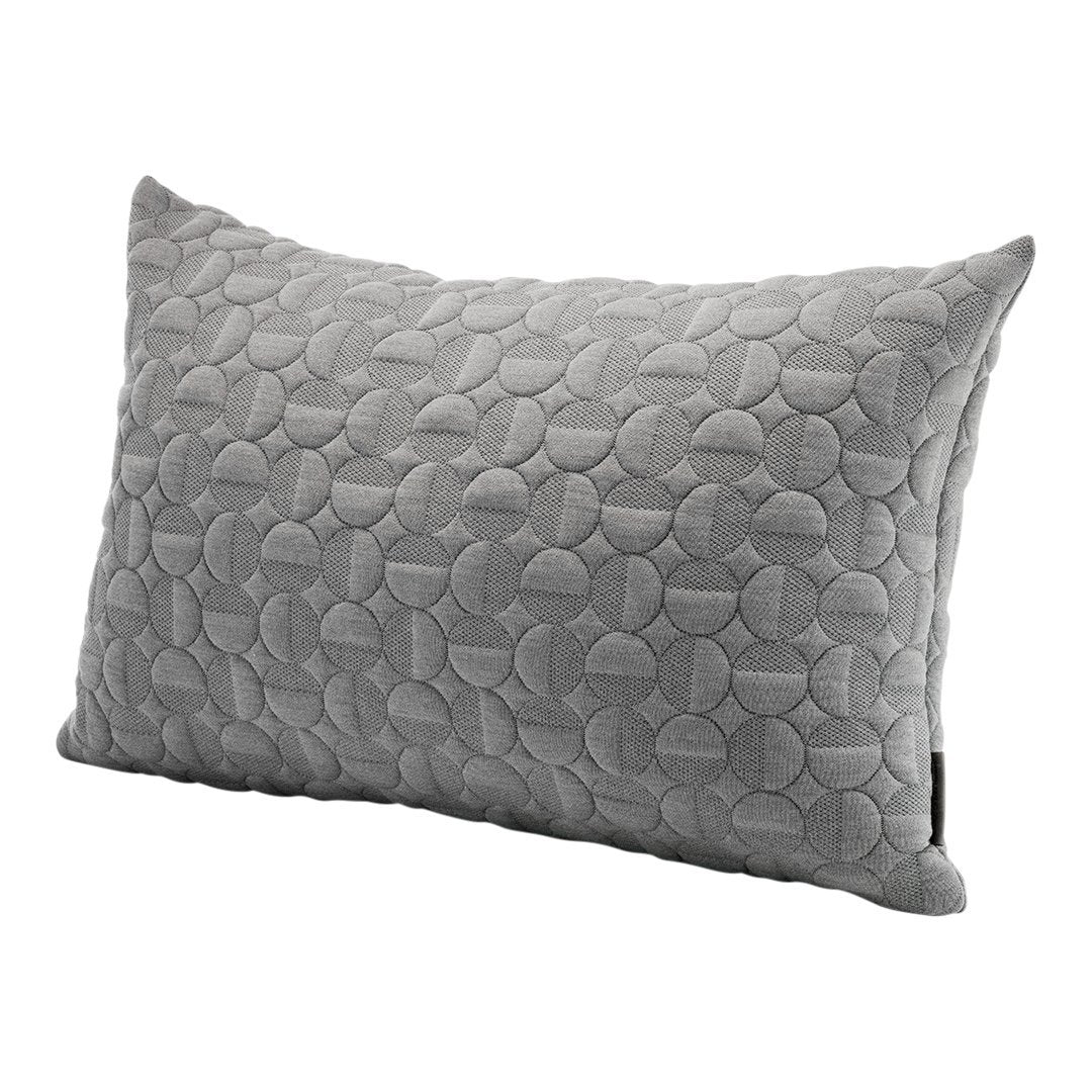 Gray decorative pillow featuring a textured pattern of overlapping circles. Ideal for modern or minimalist decor.