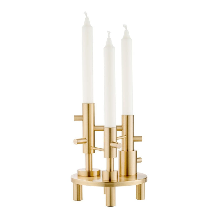 Gold candle holder with three white taper candles, featuring a modern geometric design. Perfect for elegant decor.