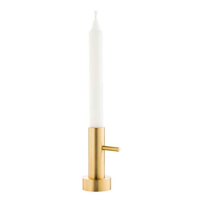 Sleek gold candle holder with a white taper candle, showcasing a minimalist design and elegant color contrast.