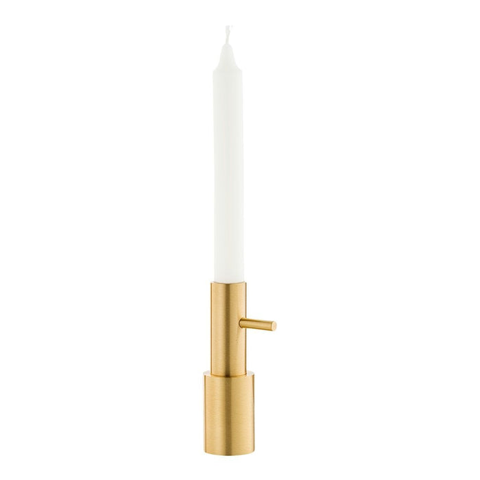 Elegant white candle in a sleek gold holder, adding a touch of modern sophistication to any decor.
