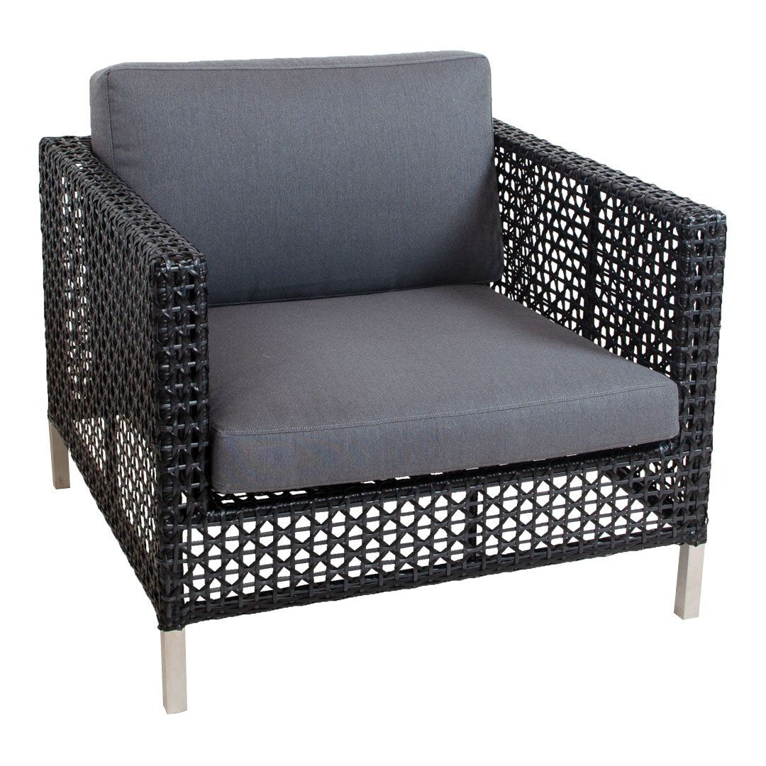 Black woven chair with a gray cushion, featuring a modern geometric pattern and sleek metallic legs.