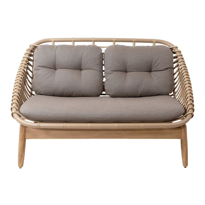 Natural rattan loveseat with tan cushions and a minimalist design, featuring a woven pattern and light wood finish.