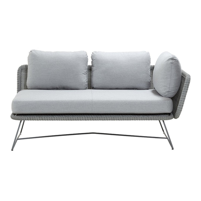 Light gray woven outdoor sofa with plush cushions and sleek metal frame. Modern design and neutral color palette.