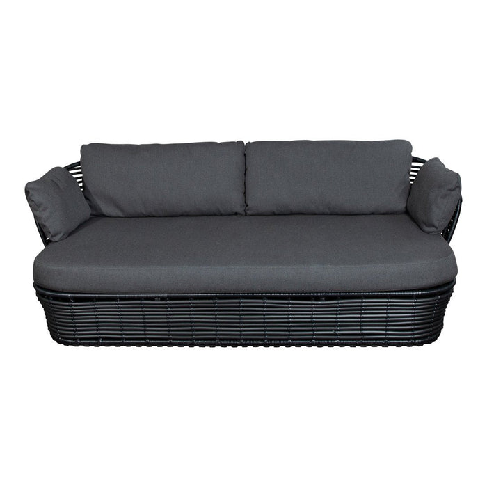 Black wicker sofa with gray cushions, featuring a sleek, modern design for outdoor or indoor use.