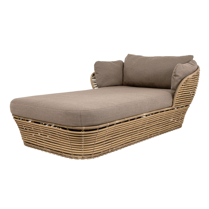 Brown fabric cushions atop a natural woven rattan chaise lounge with a sleek, modern design. Perfect for outdoor relaxation.