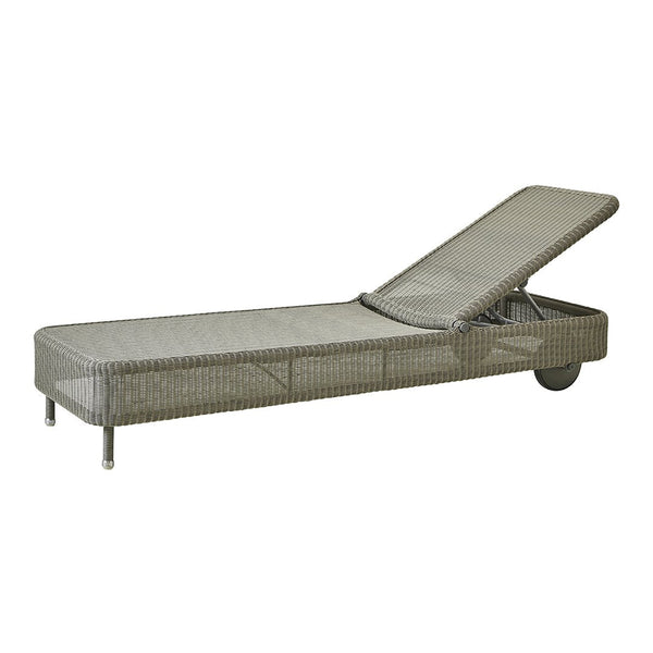 Gray wicker outdoor lounge chair with a sleek, textured finish and adjustable backrest. Perfect for patio relaxation.