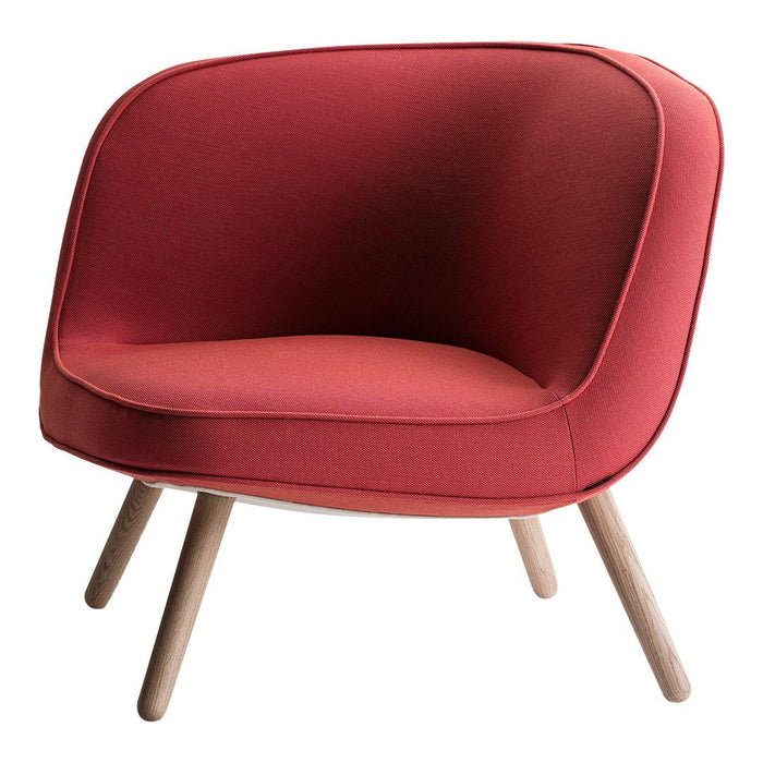 Red upholstered chair with a curved design and light wooden legs, creating a modern and cozy appearance.