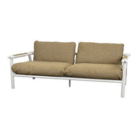 Tan upholstered sofa with a textured pattern and a white metal frame, featuring wooden armrests.