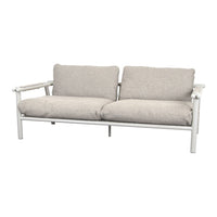 Light gray cushions on a white frame, featuring a soft, textured fabric for a modern, minimalist look.
