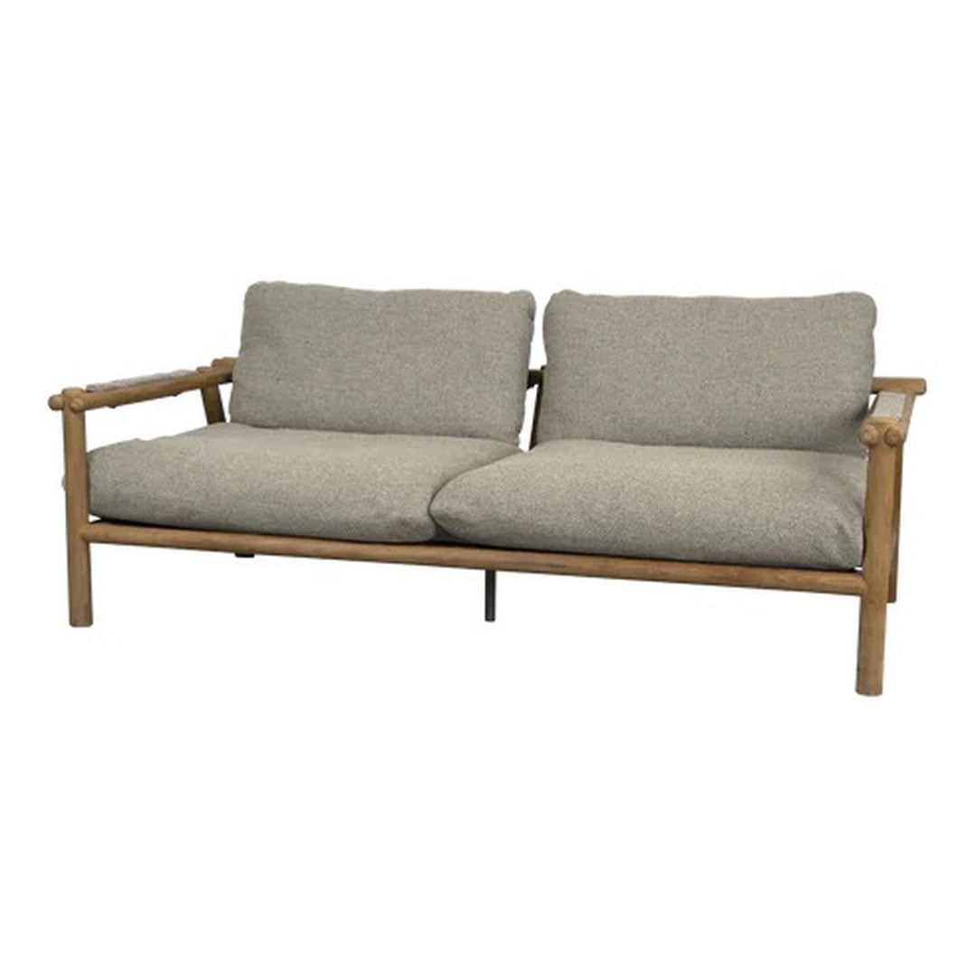 Light beige cushions on a natural bamboo frame, offering a cozy and modern minimalistic design.