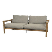 Light beige cushions on a natural bamboo frame, offering a cozy and modern minimalistic design.