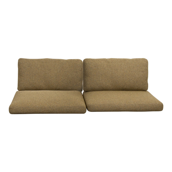 Tan fabric cushions with a textured weave, designed for versatile seating arrangements.