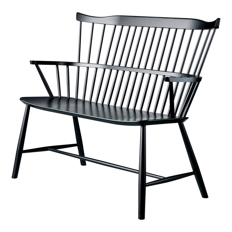 "Modern black wooden bench with sleek lines and a minimalist spindle pattern."
