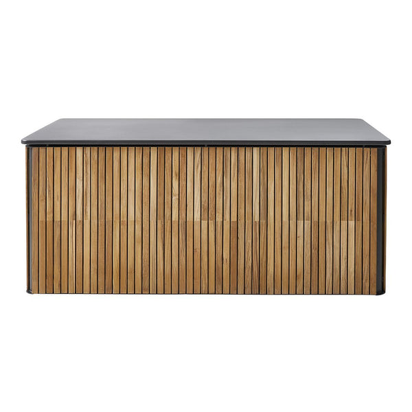 Modern wooden cabinet with vertical bamboo stripes and a sleek black top. Warm tones and textured design for stylish decor.
