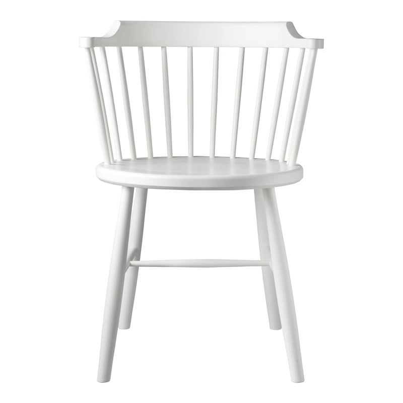 White wooden chair with a spindle back design and smooth circular seat. Simple, modern, and versatile for any decor.