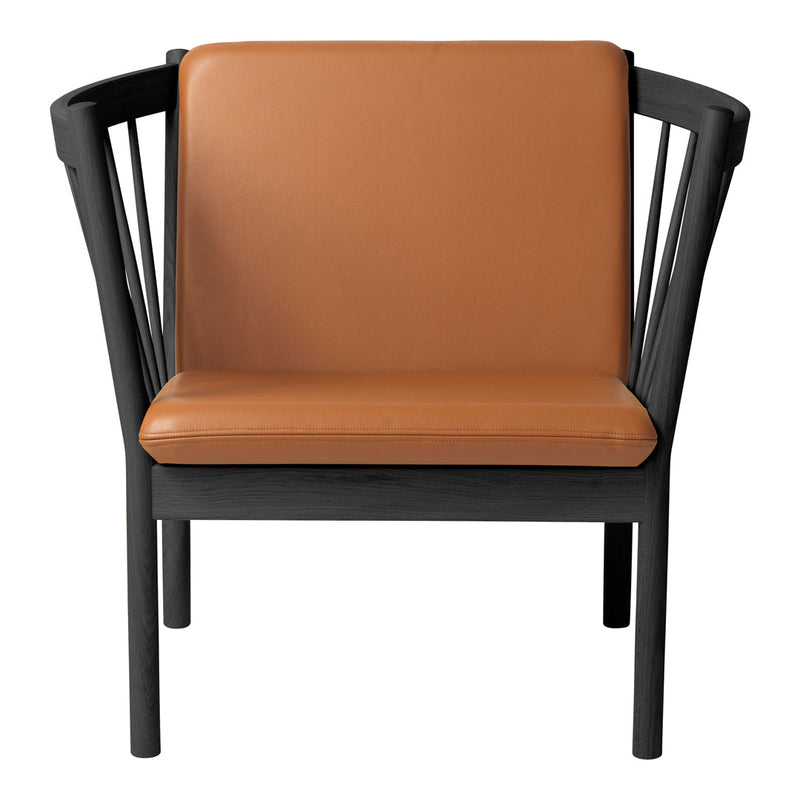 Black-framed chair with a sleek design featuring a warm tan leather seat. Modern and stylish accent piece.