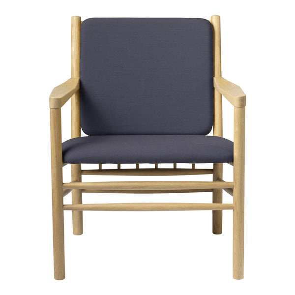 Modern wooden chair with a light natural finish and solid navy blue cushions. Simple, minimalist design.