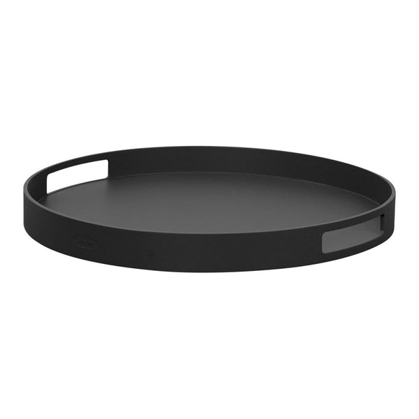 Black round tray featuring smooth, matte finish and minimalistic design with cut-out handles.