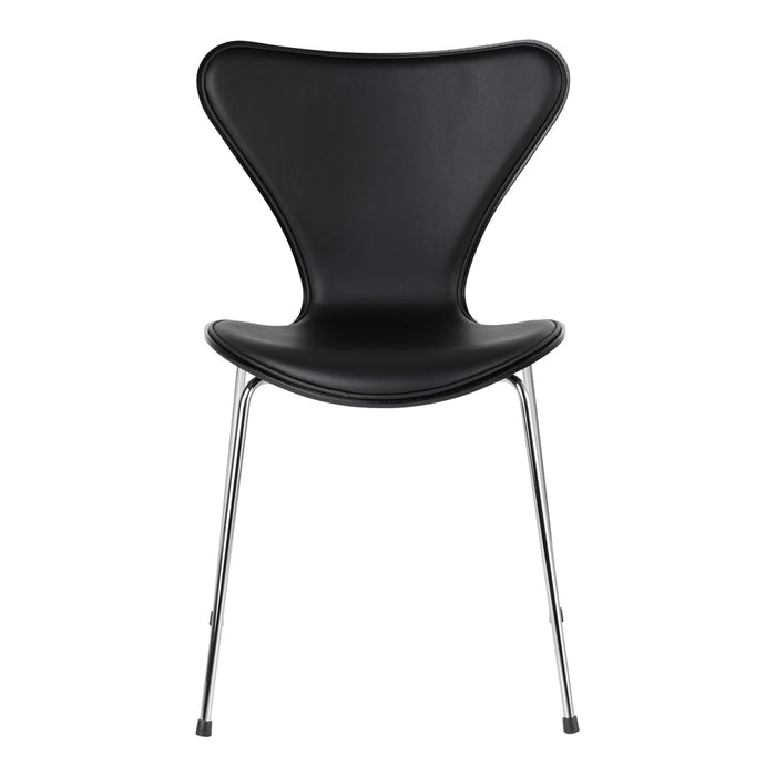 Black molded chair with a sleek, glossy finish and chrome legs, showcasing a modern, minimalist design.