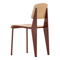 Modern chair featuring a natural wood seat and rich burgundy legs, showcasing sleek lines and minimalist design.