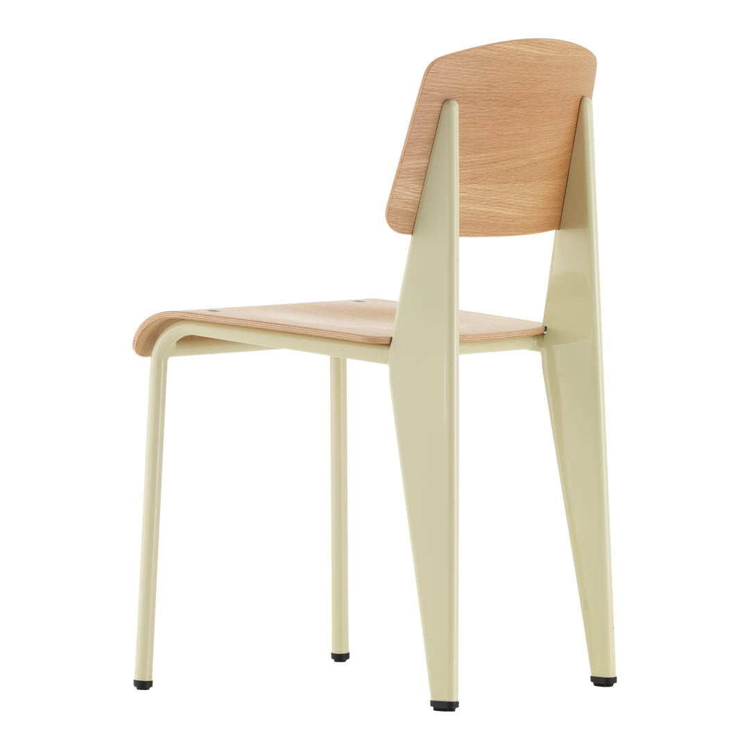 Light beige wooden chair with a pale green frame and smooth, minimalist design. Perfect for modern decor.