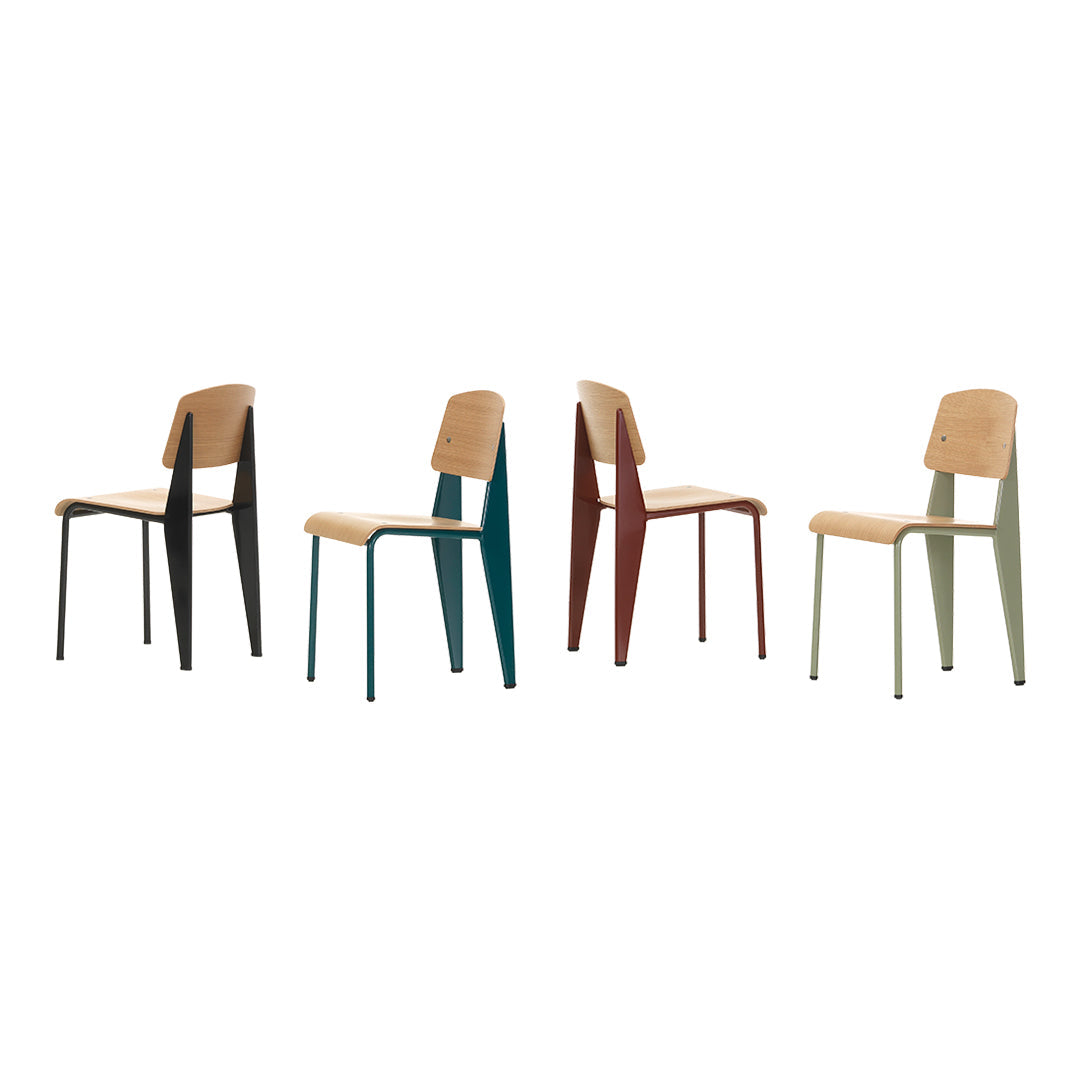 Four modern chairs featuring natural wood seats and legs in black, teal, burgundy, and olive green.