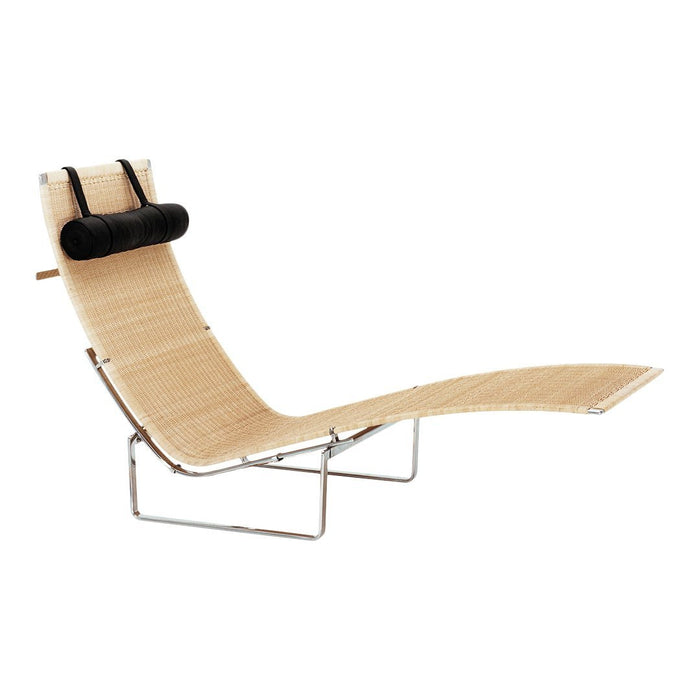 Light brown curved lounge chair with a smooth, minimalist design and contrasting black headrest. Modern, elegant, and stylish.