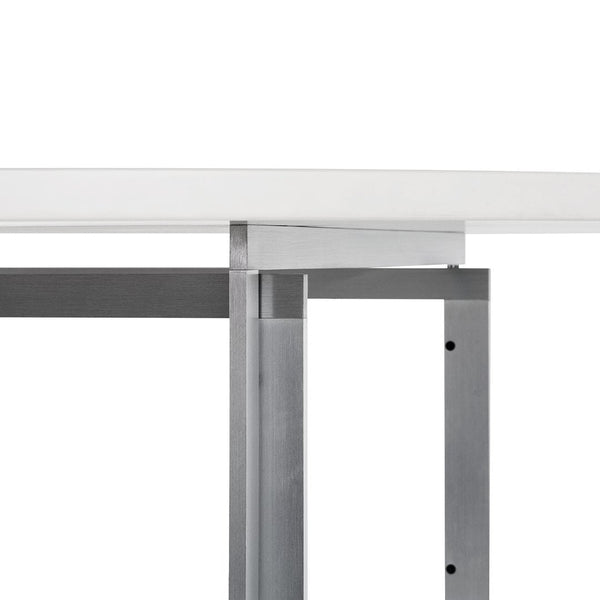 White tabletop with sleek silver metal legs, featuring a modern, minimalist design.