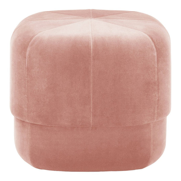 Soft pink velvet pouf with subtle diamond quilting pattern, perfect for modern decor.