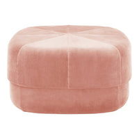Soft pink velvet ottoman with a geometric, quilted pattern, perfect for modern decor.