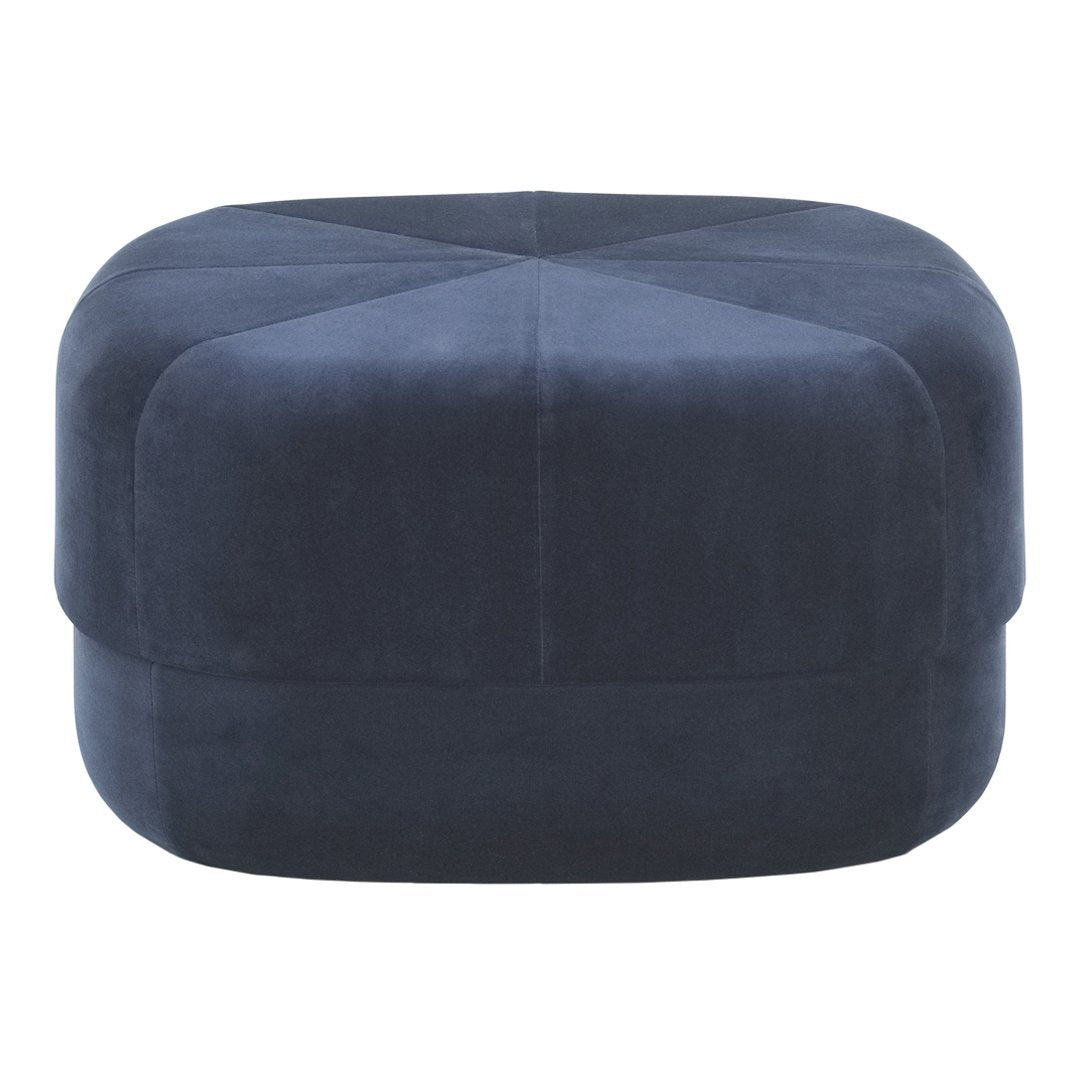 Navy blue velvet ottoman with a sleek, geometric pattern and soft, textured finish. Perfect for modern decor.