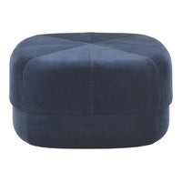 Navy blue velvet ottoman with a sleek, geometric pattern and soft, textured finish. Perfect for modern decor.